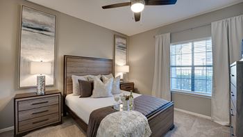 Bedroom with wooden furniture and ceiling fan